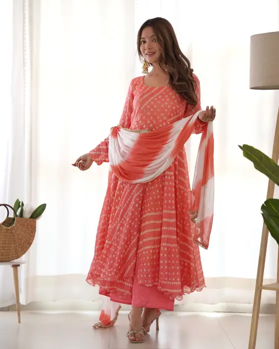 Cream peach anarkali set . This set is having round neck with back neck tasseled paired with falred palazzo along with lejeriya chiffon dupatta detailing of lace.The colors seen in the image may vary from the actual product due to different computer scree